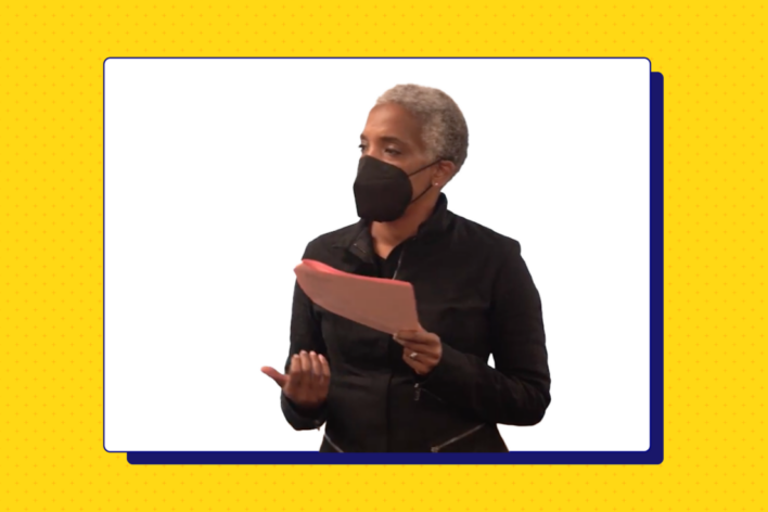 image of individual wearing a mask and holding notes framed in a white square on a yellow background