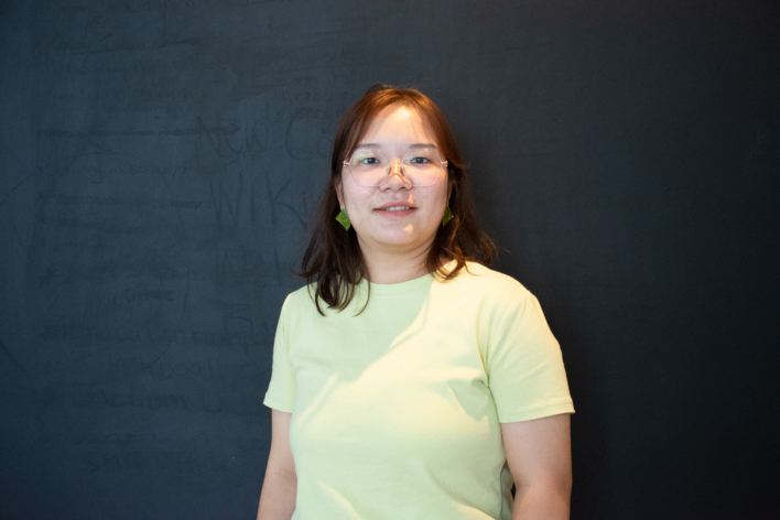 Xianru Daphne Luo in a light green shirt, smiling at the camera