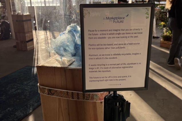 A white sign that explains the mission of Marketplace of the Future.