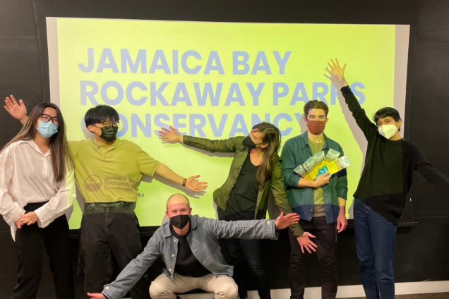 Students with Jamaica Bay Rockaway Parks Conservancy team in front of a screen